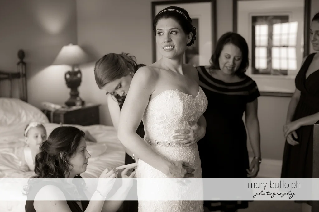 Bride looks great in her wedding gown thanks to her friends at the Inns of Aurora Wedding