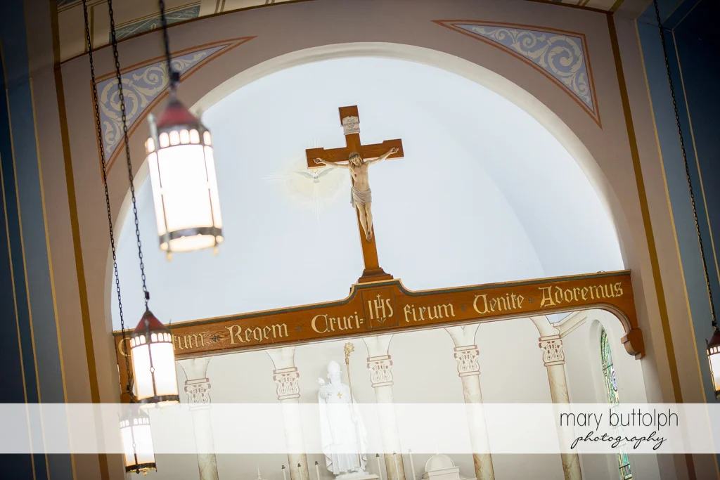 The crucifix is a silent witness to the wedding ceremony at the Inns of Aurora Wedding
