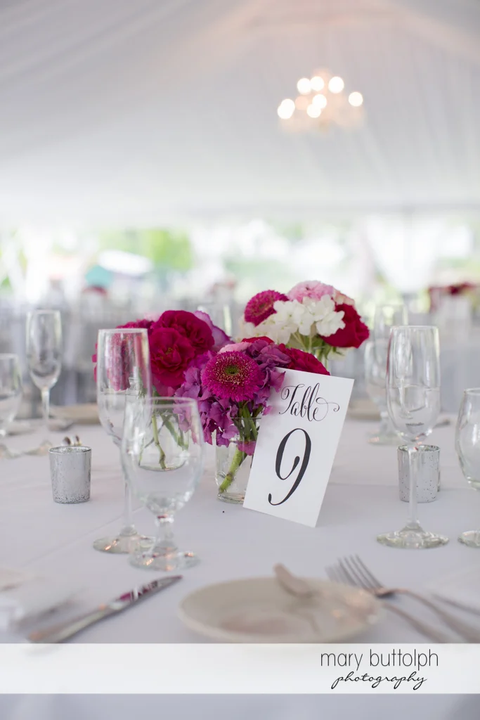 One of the tables with a bouquet at the Inns of Aurora Wedding