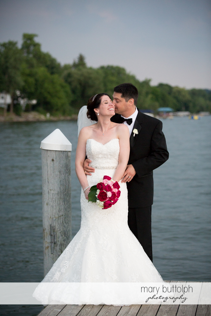Couple stand in front of the lake at the Inns of Aurora Wedding