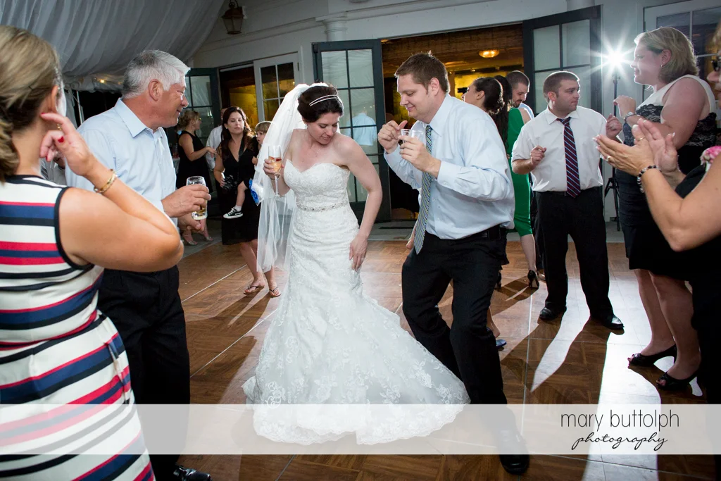 Couple show their dance moves to guests at the Inns of Aurora Wedding