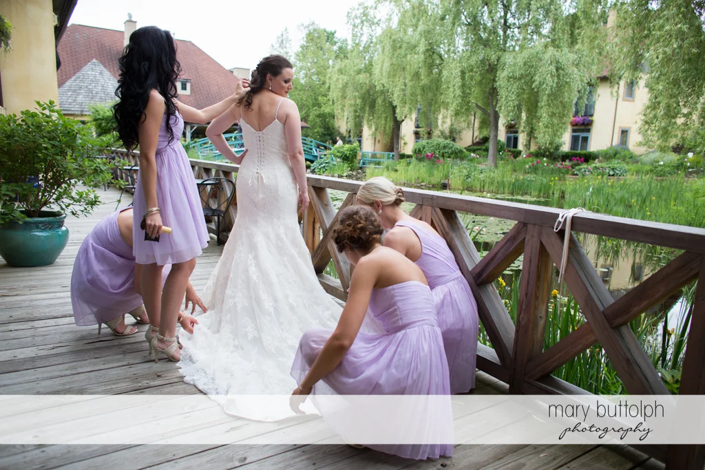 Bride and her bridesmaids on the porch at the Mirbeau Inn & Spa Wedding