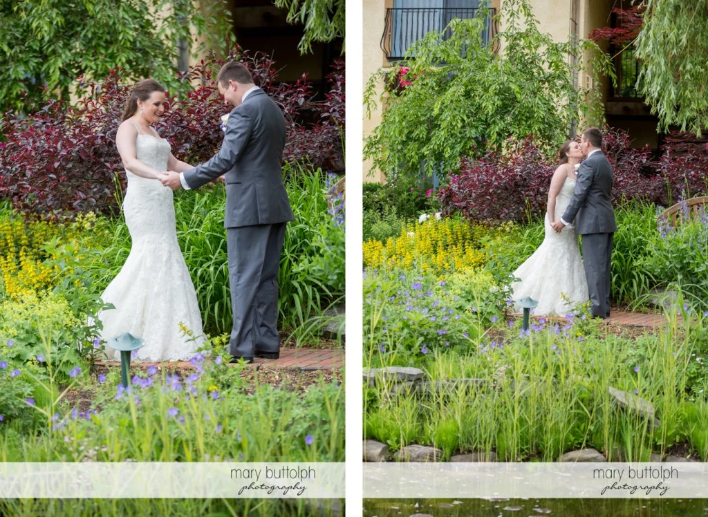 Couple meet and kiss in the garden at the Mirbeau Inn & Spa Wedding