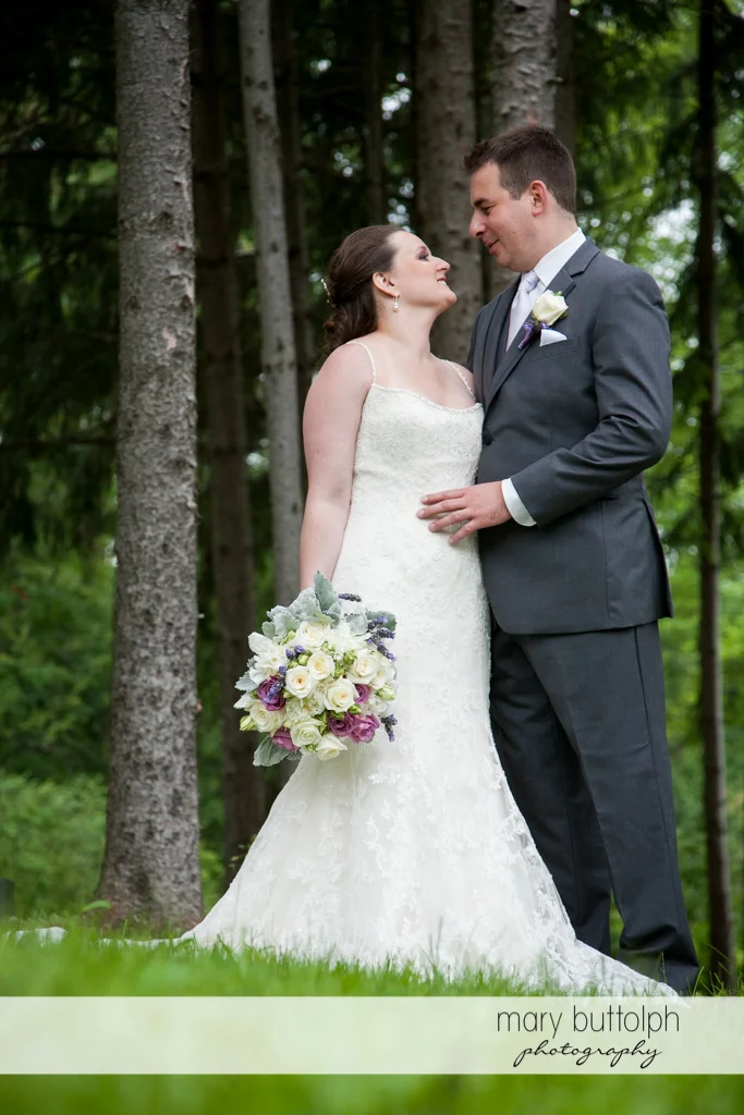 Couple spend time in the woods at the Mirbeau Inn & Spa Wedding