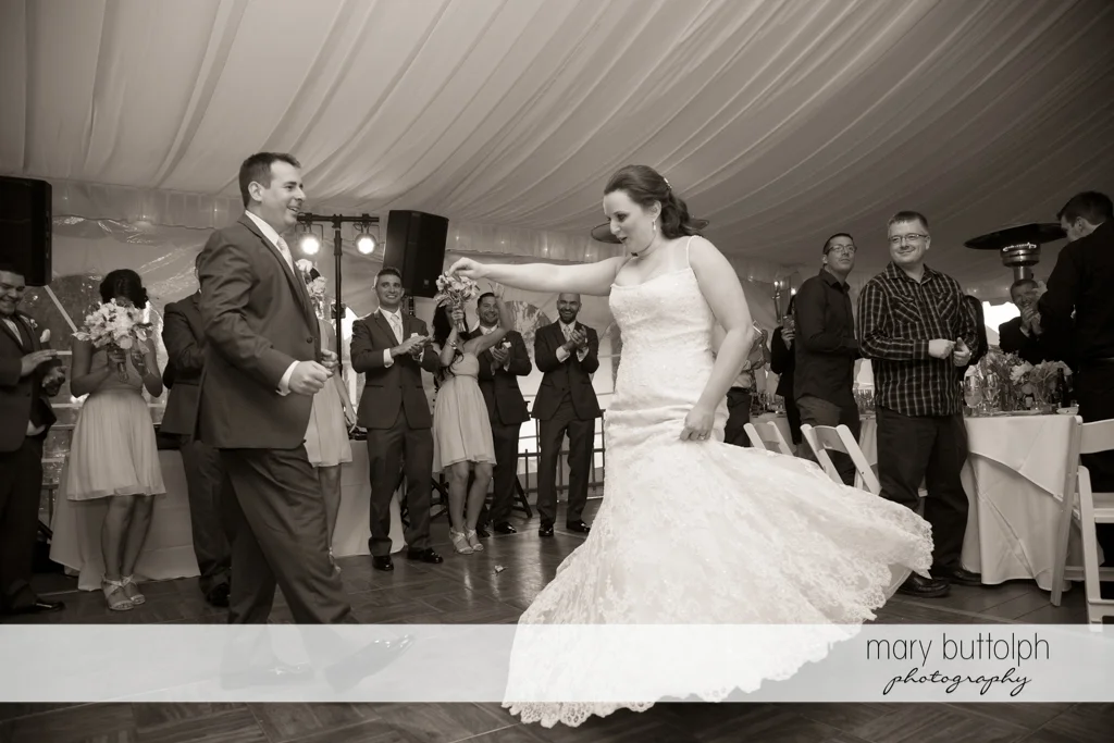 Couple dance as guests look on at the Mirbeau Inn & Spa Wedding