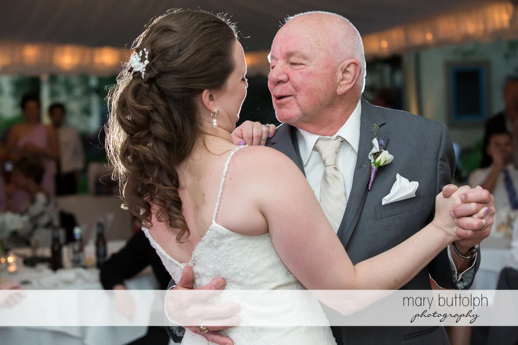 Bride dances with her father at the wedding venue at the Mirbeau Inn & Spa Wedding
