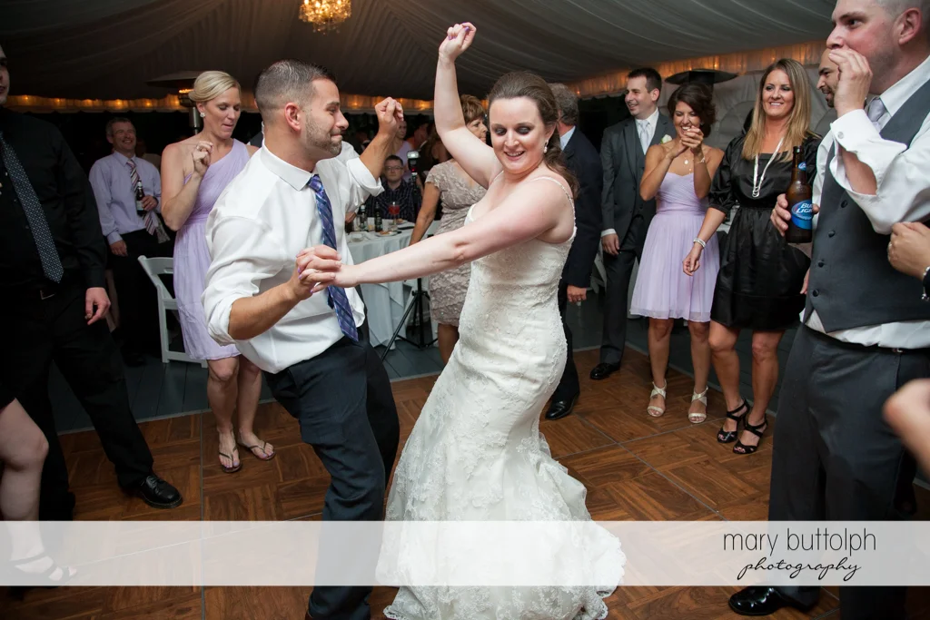 Bride shows her moves on the dance floor at the Mirbeau Inn & Spa Wedding