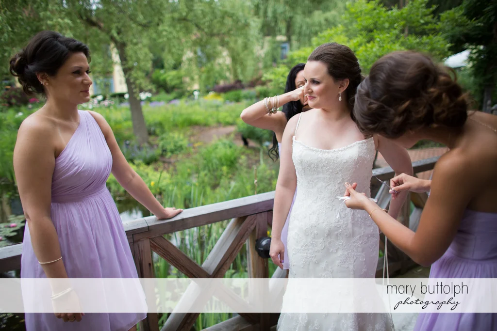 Bride and her guests relax on the porch at the Mirbeau Inn & Spa Wedding