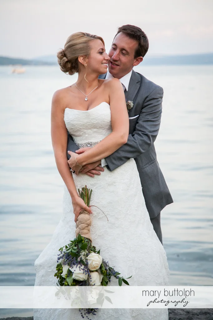 Couple pose in front of the lake at the Sherwood Inn Wedding