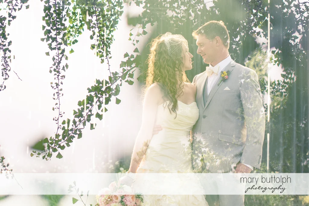 Couple pose in the garden at the Inns of Aurora Wedding