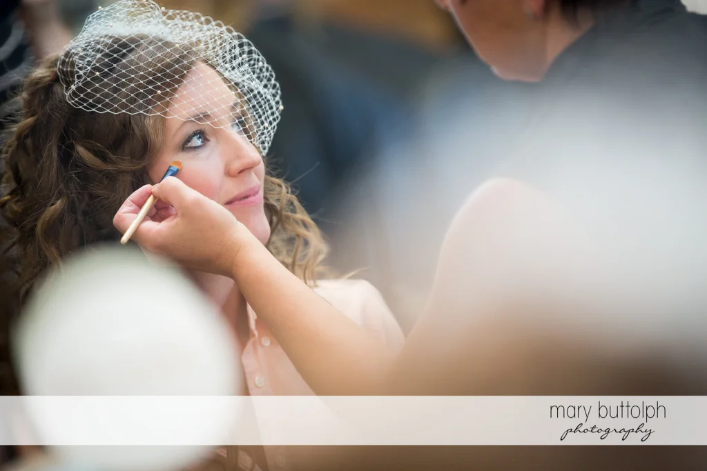 Bride gets a makeover at the Inns of Aurora Wedding