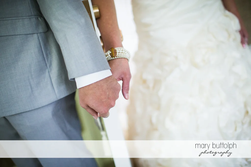 Couple hold hands at the Inns of Aurora Wedding