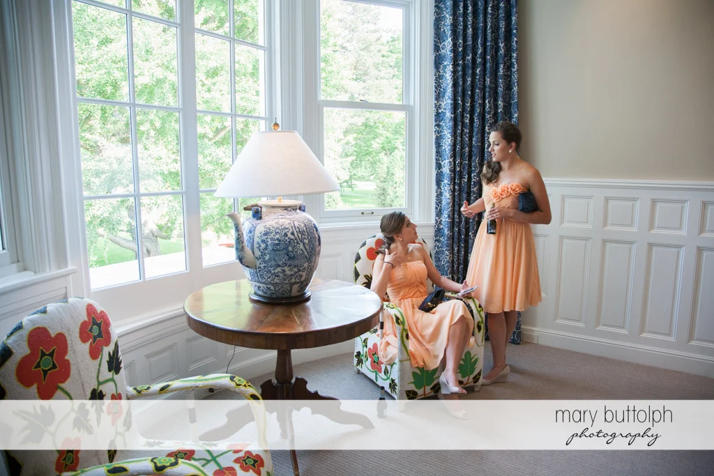 Bridesmaids talk at the lobby of the Inns of Aurora Wedding
