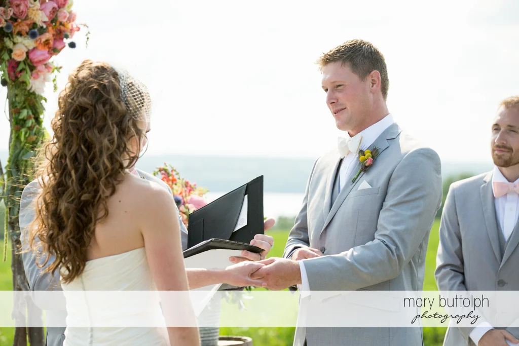 Couple hold hands during the wedding ceremony at the Inns of Aurora Wedding