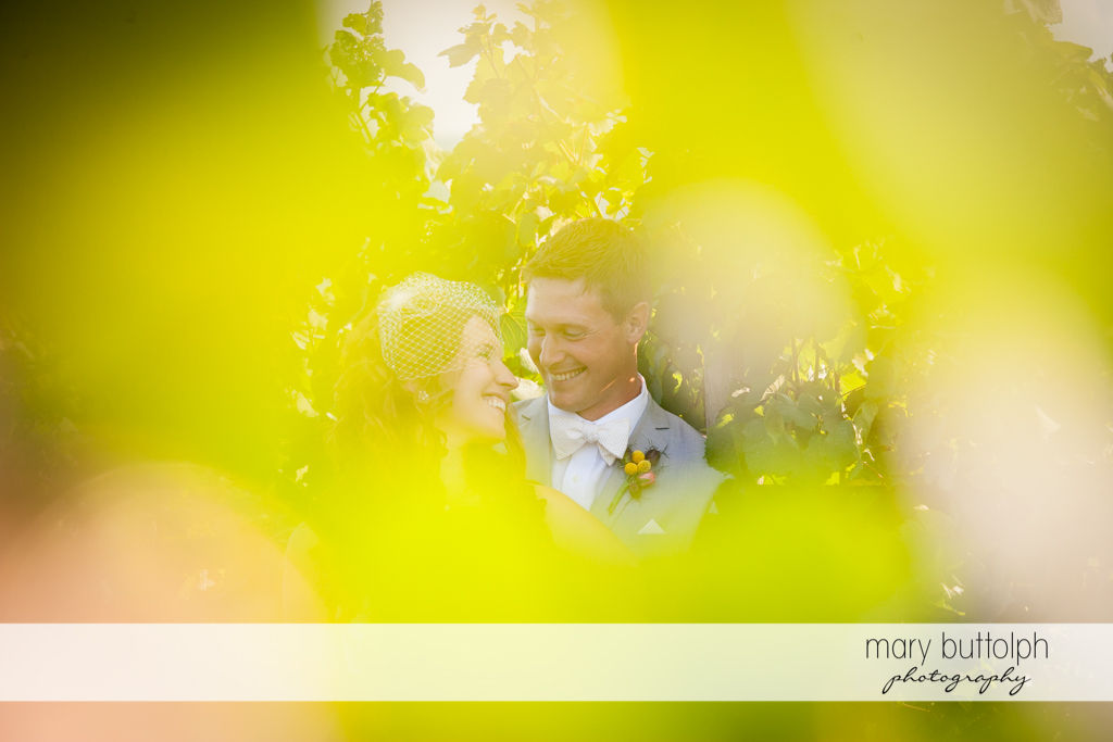 Trick shot of the couple in the vineyard at the Inns of Aurora Wedding