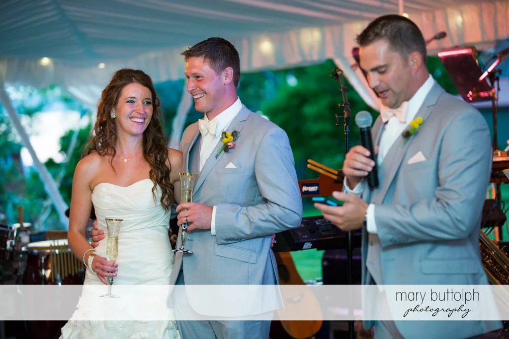 Couple and host preside over the wedding program at the Inns of Aurora Wedding