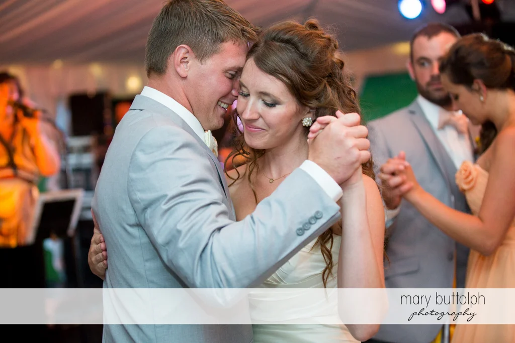 Couple get romantic while dancing at the Inns of Aurora Wedding