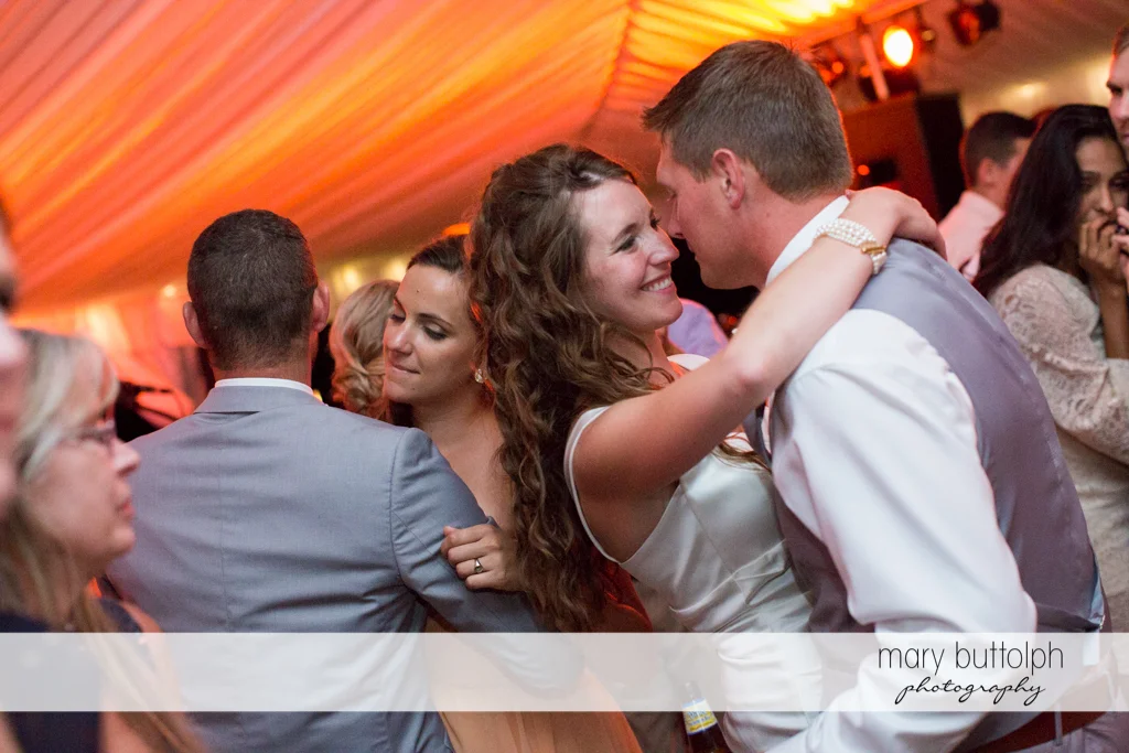 Couple dance with guests at the Inns of Aurora Wedding