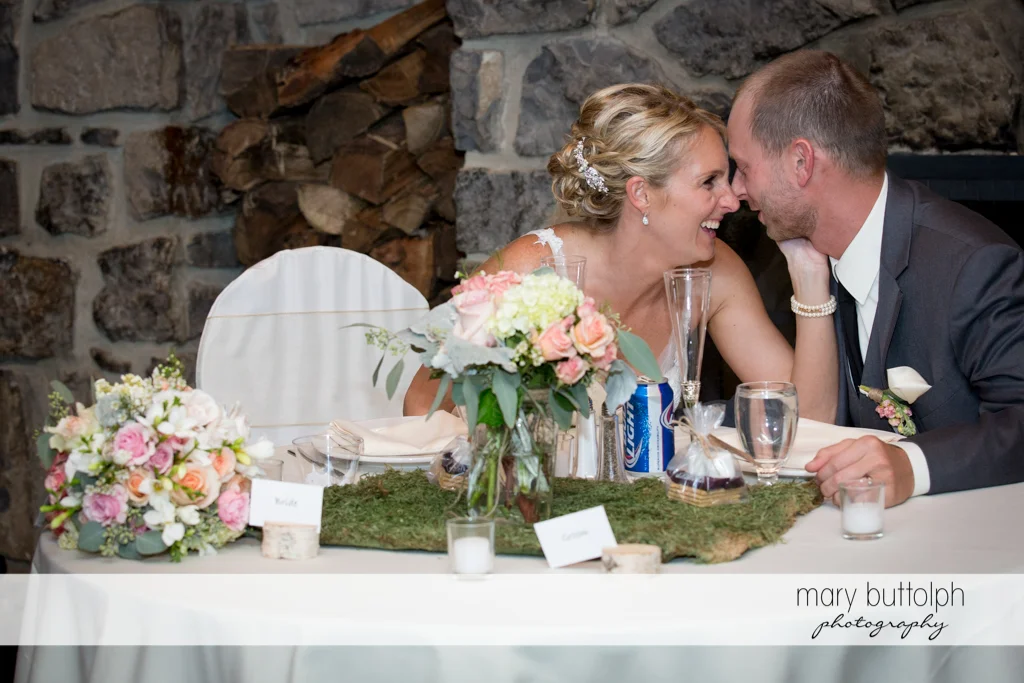 Couple rub noses at the wedding venue at Arrowhead Lodge Wedding
