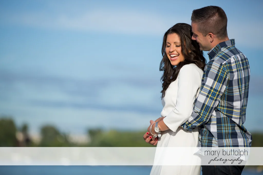 Couple enjoy each other's company near the lake at Skaneateles Country Club Engagement