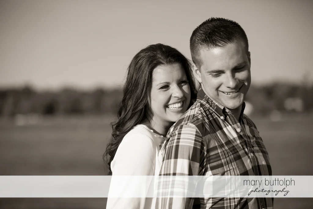 Couple can't hide their happy faces in this photo shoot at Skaneateles Country Club Engagement