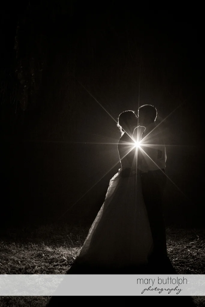 Couple kiss in the garden at the Hamilton Inn Wedding