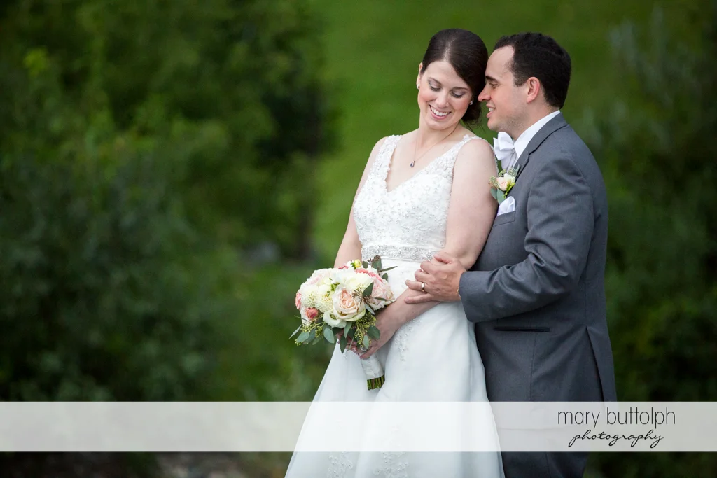 Couple pose in the garden at the Inns of Aurora Wedding