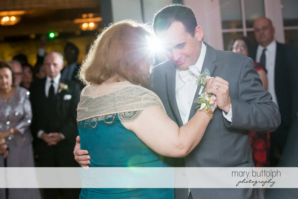 Groom dances with a guest at the Inns of Aurora Wedding