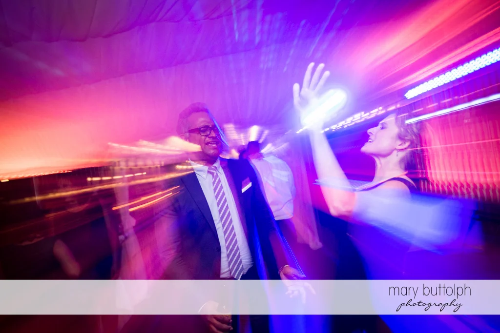 Guests light up the dance floor at the Inns of Aurora Wedding