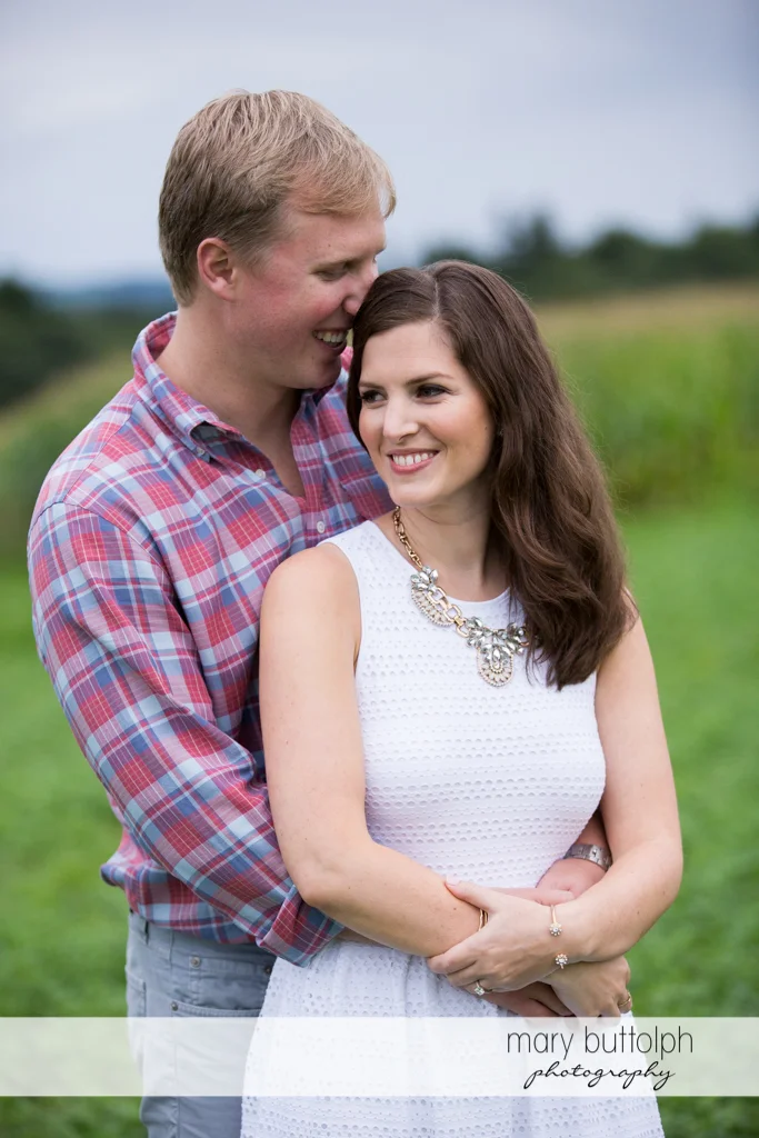 Couple pose for posterity in the garden at Hobbit Hollow House Engagement