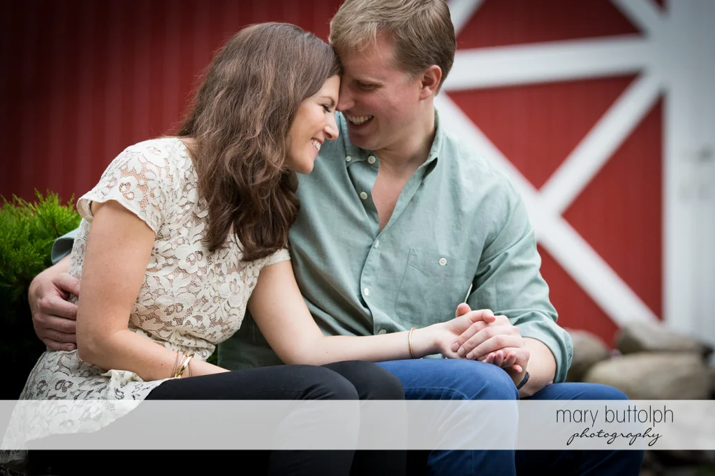Couple share a happy moment at Hobbit Hollow House Engagement