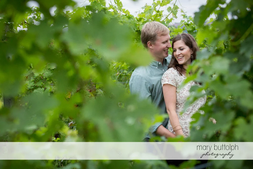 Couple pose in the garden at Hobbit Hollow House Engagement