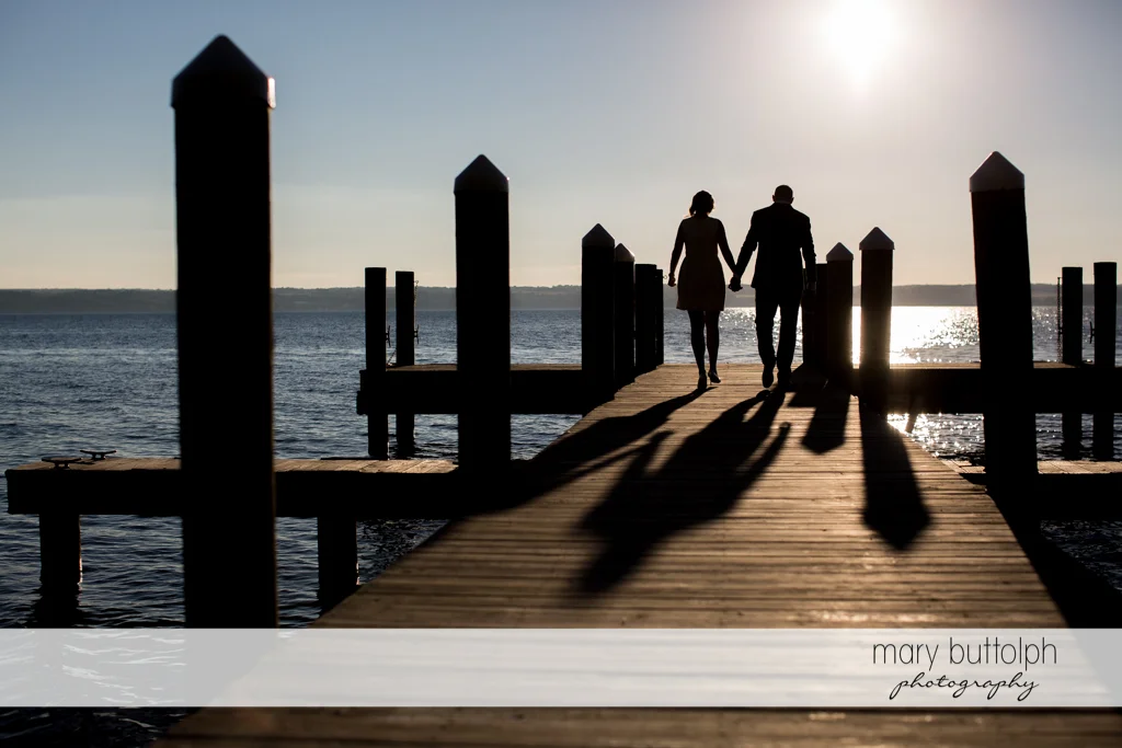 Couple catch the sunset by the lake at the Inns of Aurora Engagement