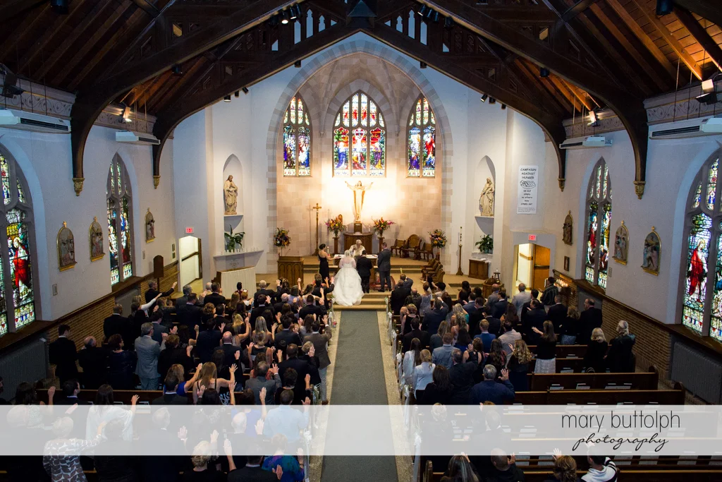 Long shot of the couple in front of the altar at Skaneateles Country Club Wedding