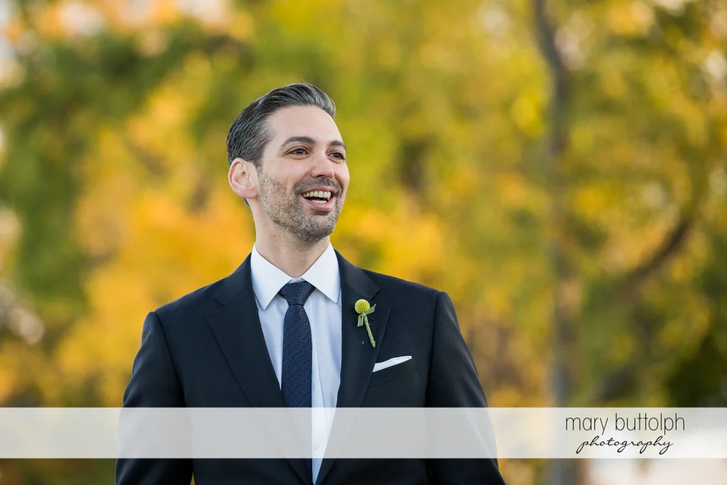 Happy groom waits for his bride at Skaneateles Country Club Wedding