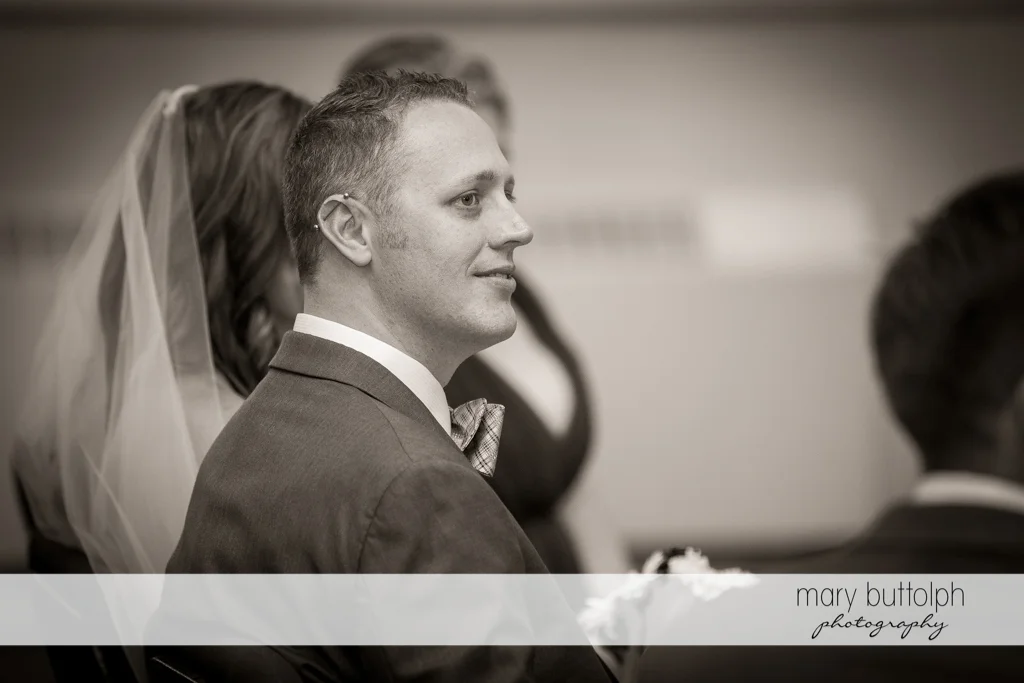 Groom looks amused in this black and white shot at the Sherwood Inn Wedding