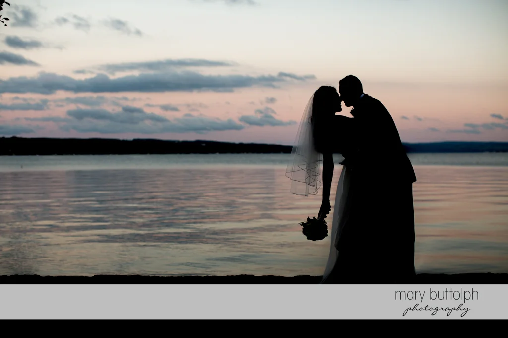 Couple enjoy their moment together by the lake at the Sherwood Inn Wedding