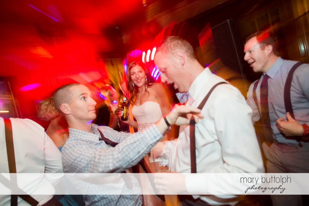 Guests clown around on the dance floor at the Sherwood Inn Wedding