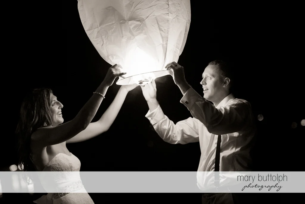 Couple hold up a paper lantern at the Sherwood Inn Wedding
