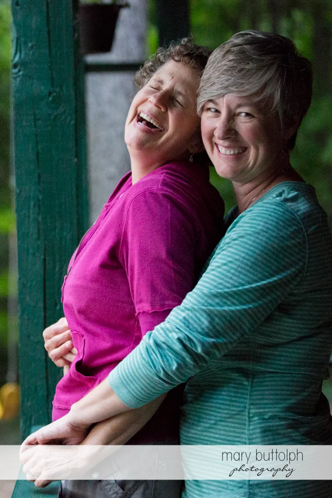 Same sex couple have fun at the photo shoot at Skaneateles Lake Engagement