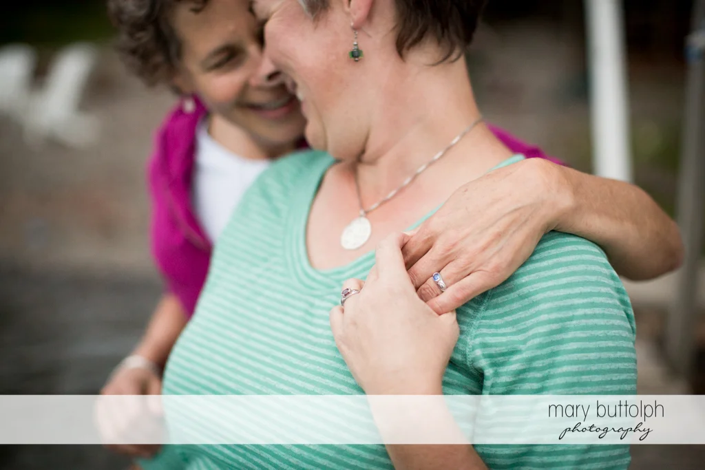 Same sex couple have fun at the photo shoot at Skaneateles Lake Engagement