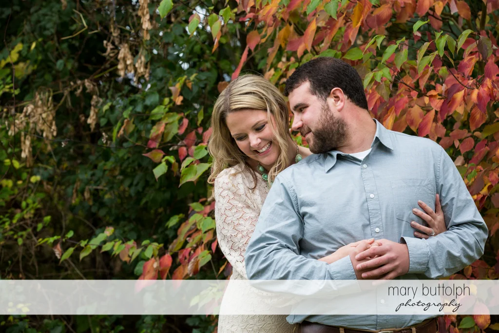 Couple cherish their time together in the garden at Beak & Skiff Apple Orchards Engagement