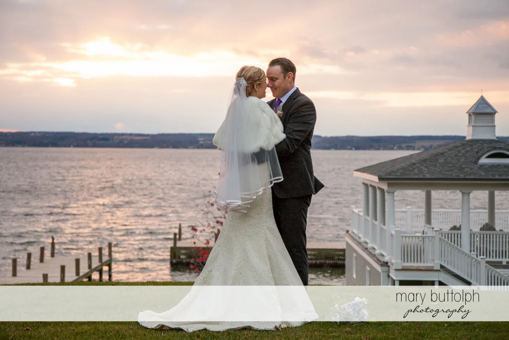 Couple pose in front of the lake at Rowland House Wedding