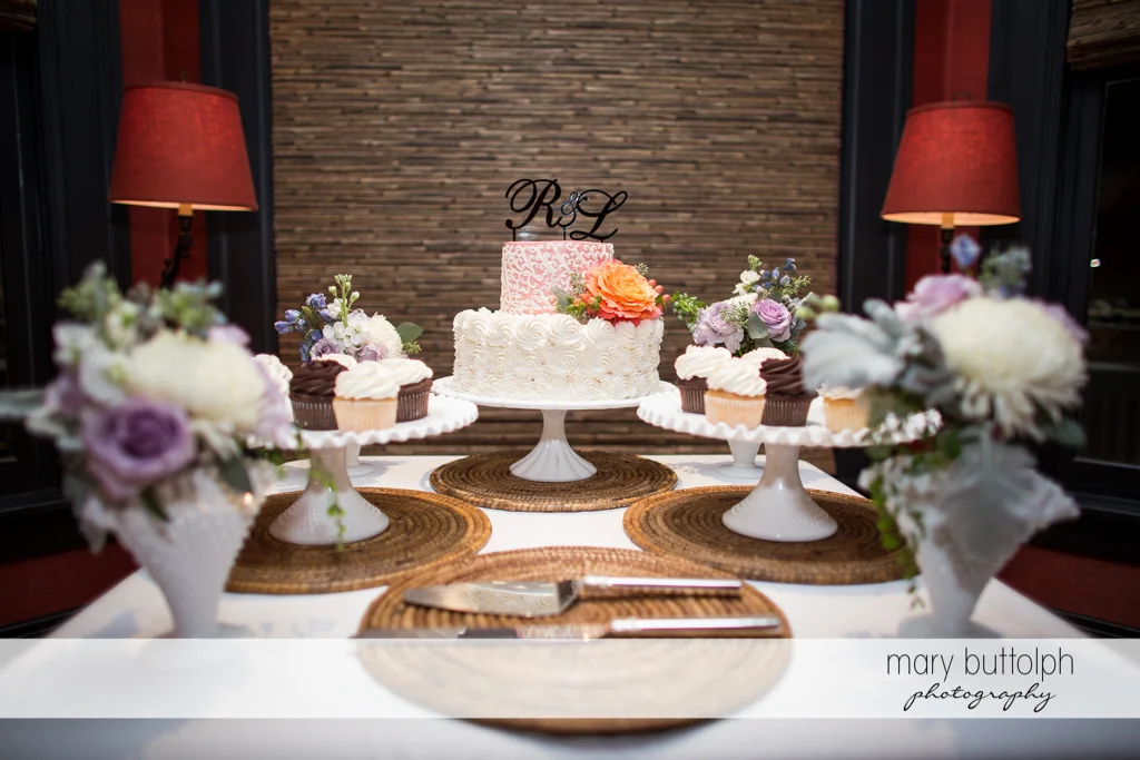 Couple's wedding cake and other pastries at the wedding venue at Rowland House Wedding