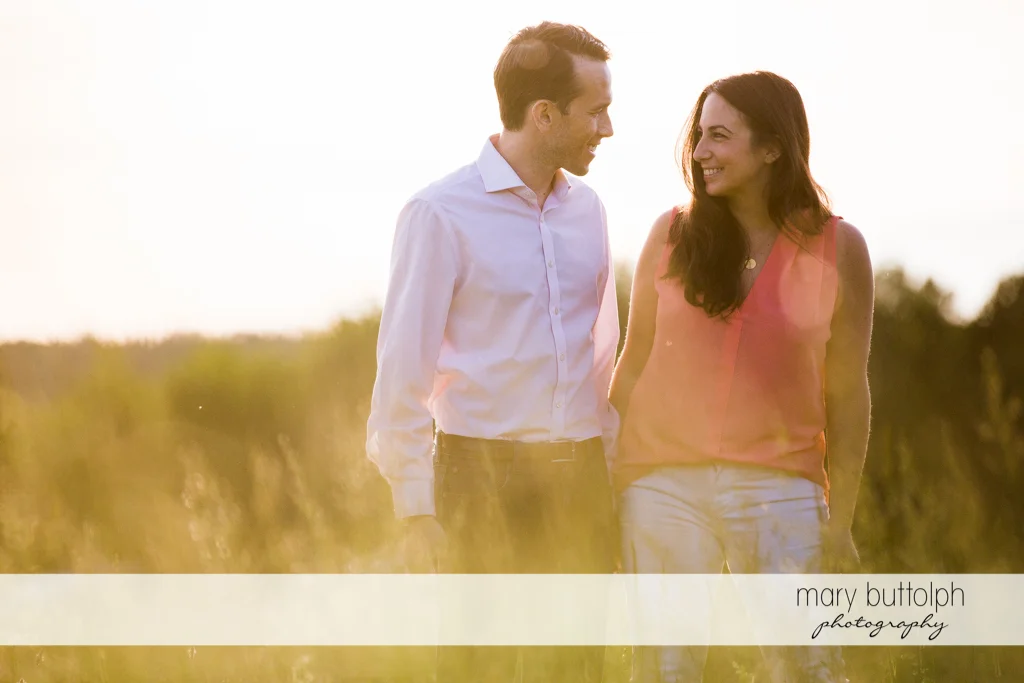 Couple stroll in the park at Cazenovia Engagement