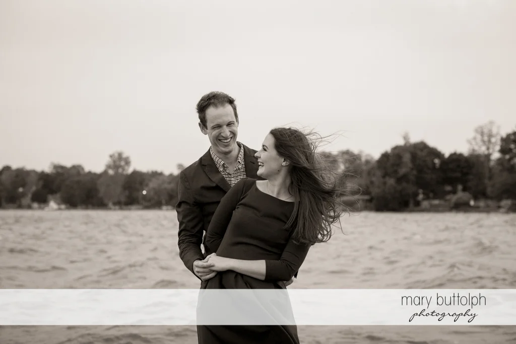 Couple take a break at the lake at Skaneateles Lake Engagement