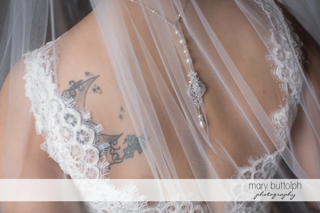 Detail of bride's wedding gown at Frog Pond Bed & Breakfast Wedding
