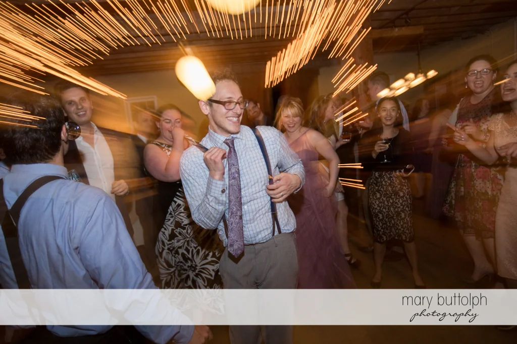 Groom and guests liven up the dance floor at Frog Pond Bed & Breakfast Wedding