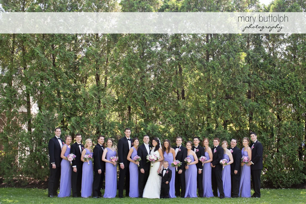 The wedding party pose for posterity in the garden at the Lodge at Welch Allyn Wedding
