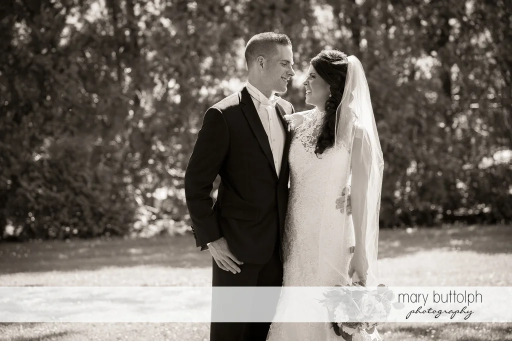 Couple in a dramatic black and white shot in the garden at the Lodge at Welch Allyn Wedding